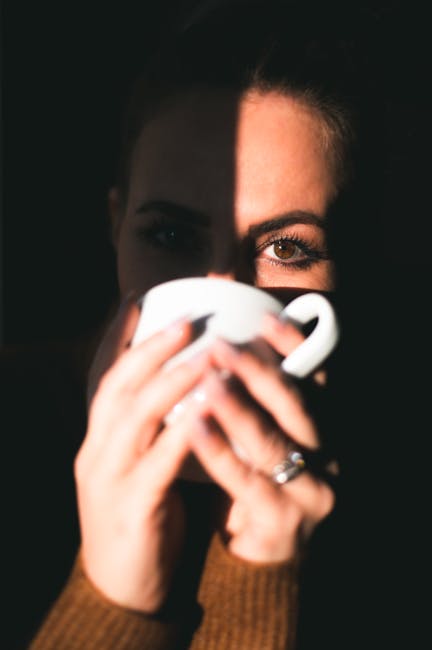 Woman enjoying a cup of tea in the morning, feeling refreshed and vibrant.